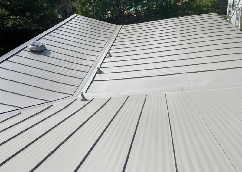 Solar attic fan installed on a metal roof for Roof Ventilation in Lincoln Park